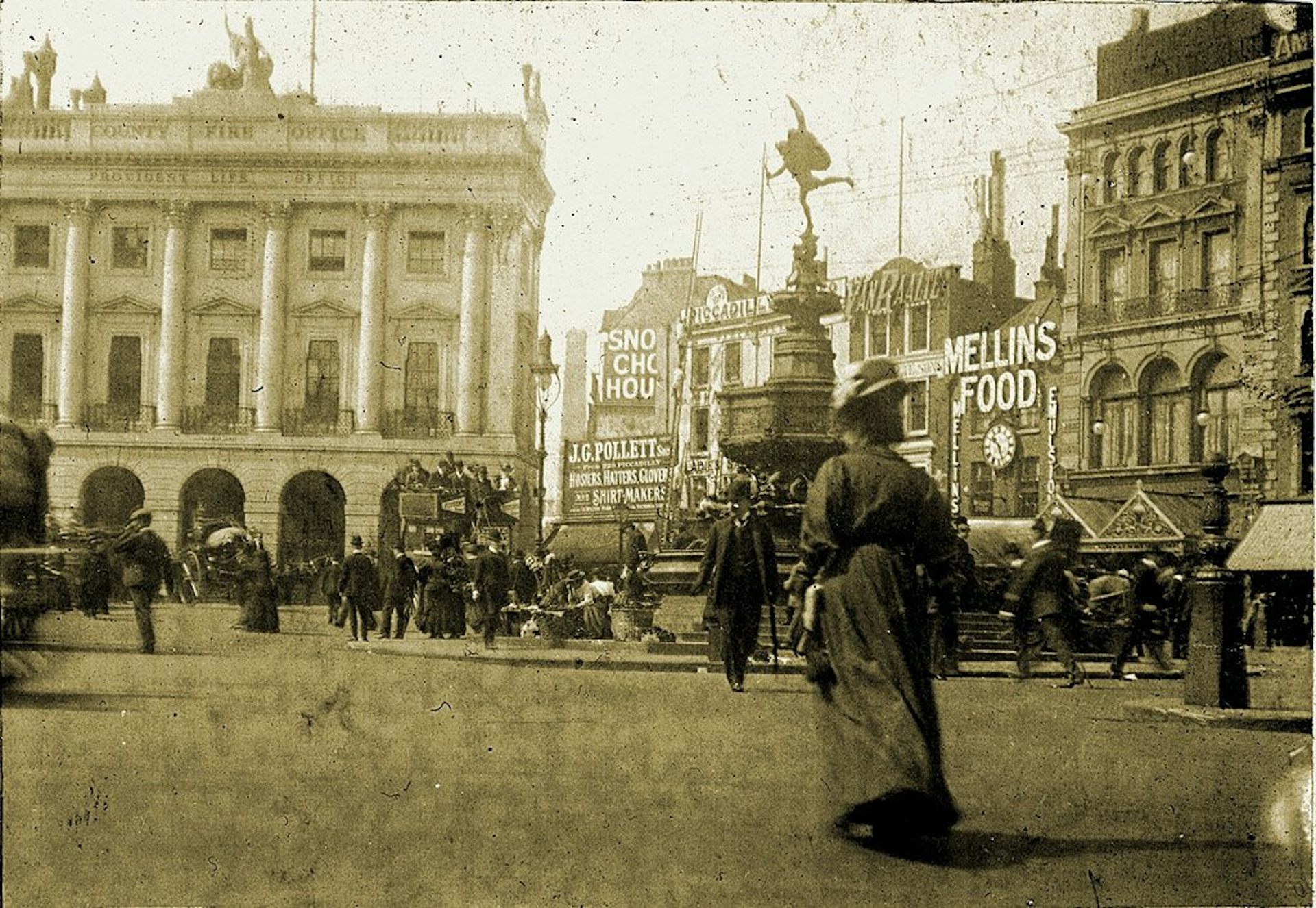 Woman standing at Piccadilly Circus, London.
